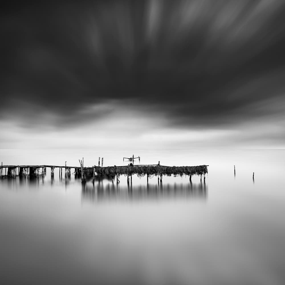 Serene Pier Reflection by George Digalakis — canvas wall art