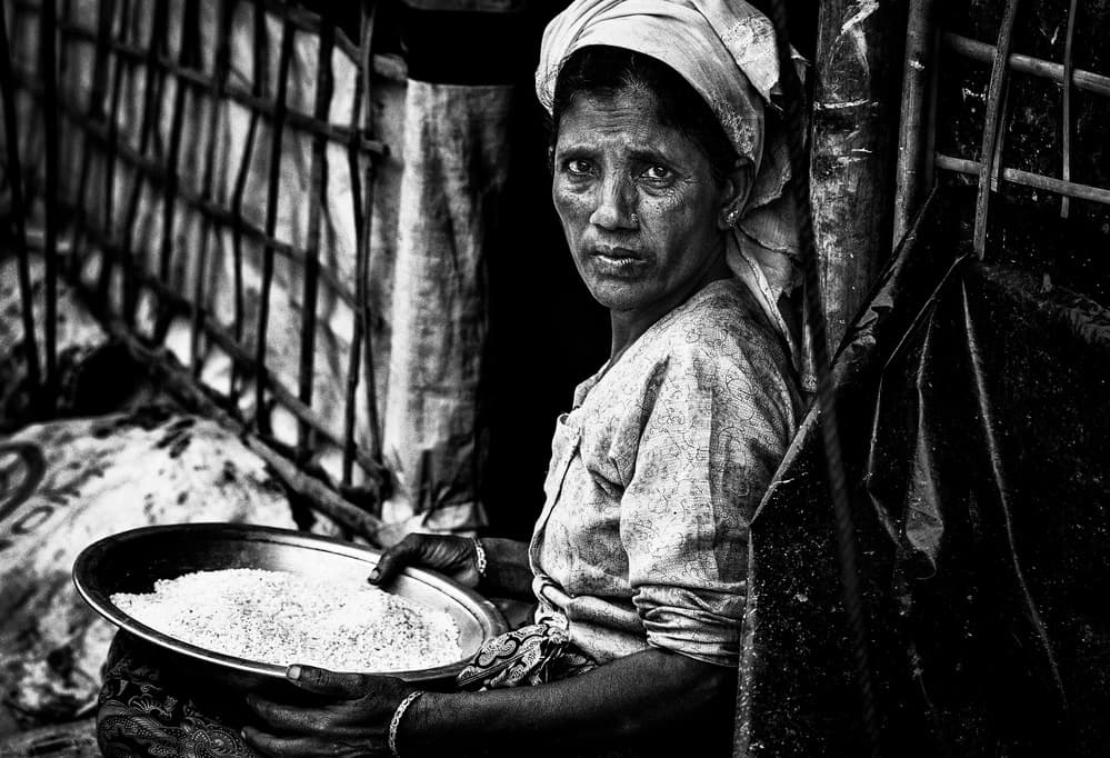 Woman Holding Rice by Joxe Inazio Kuesta Garmendia — canvas wall art