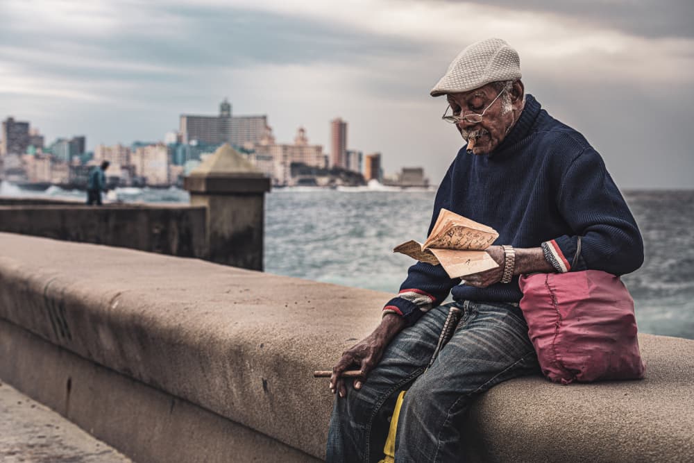 Cuban Man Sea Wall Havana by Marco Tagliarino — canvas wall art