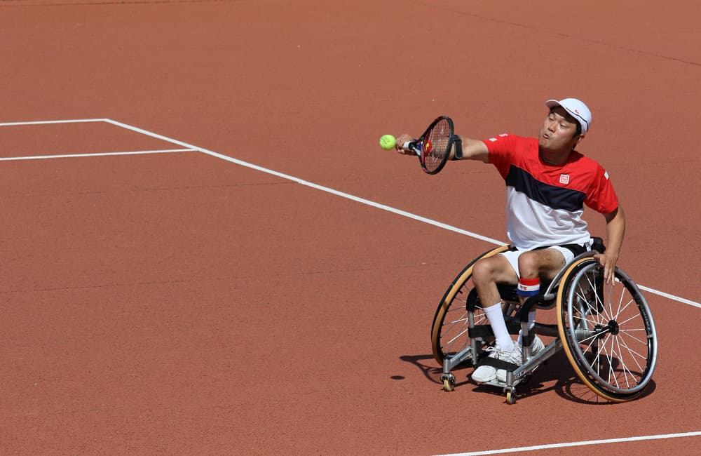 Wheelchair Tennis Serve Action by Michel Romaggi — canvas wall art