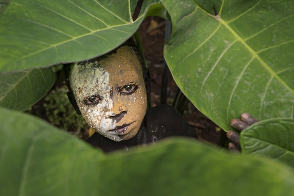 Child with Painted Face by Sarawut Intarob — canvas wall art