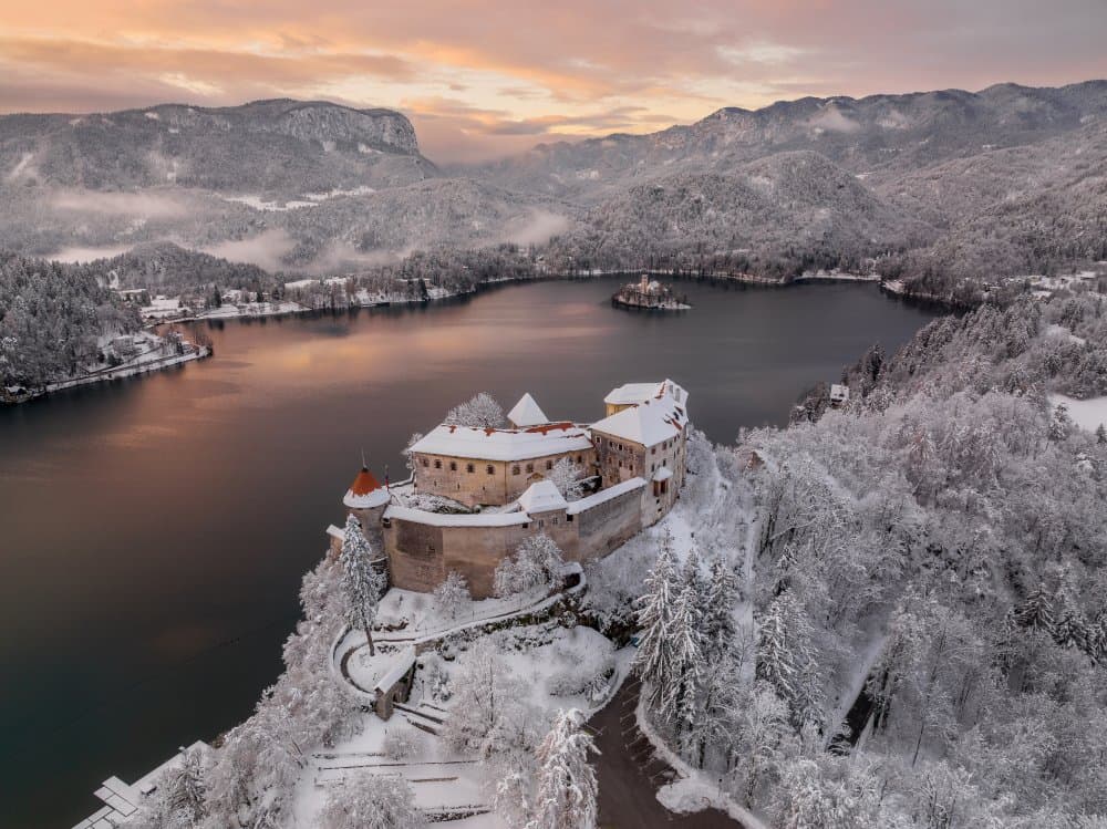 Snowy Bled Castle Dawn by Ales Krivec — canvas wall art