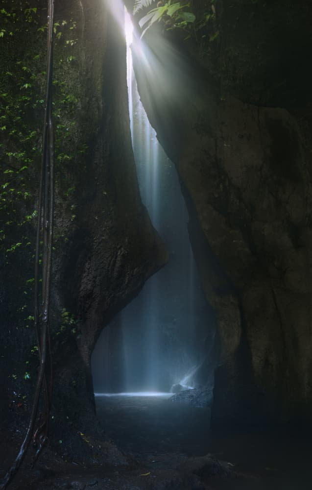 Sunlit Cave Waterfall by joanaduenas — canvas wall art