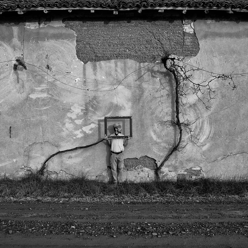 Man And Old Wall Frame by Carlo Ferrara — canvas wall art