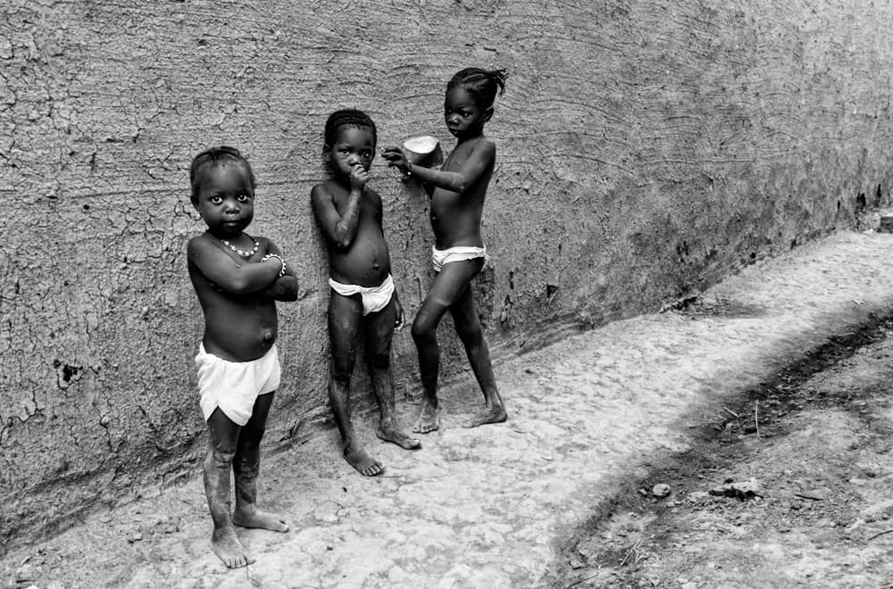 African Children Standing by Joxe Inazio Kuesta Garmendia — canvas wall art
