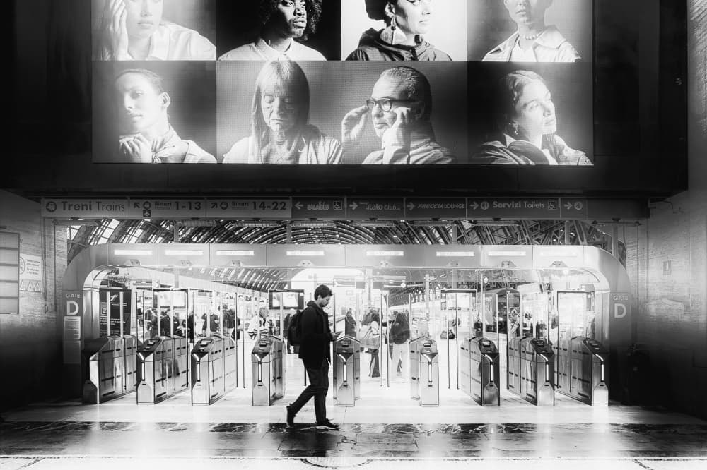 Man Walking Through Station by Leah Guo — canvas wall art