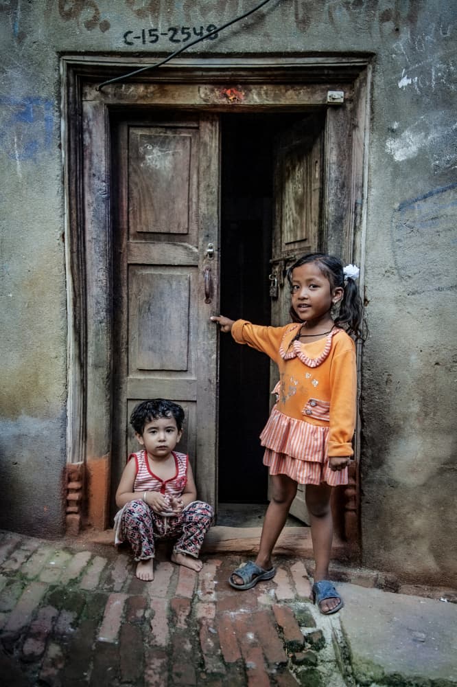 Children At Doorway by Amer Jassim — canvas wall art