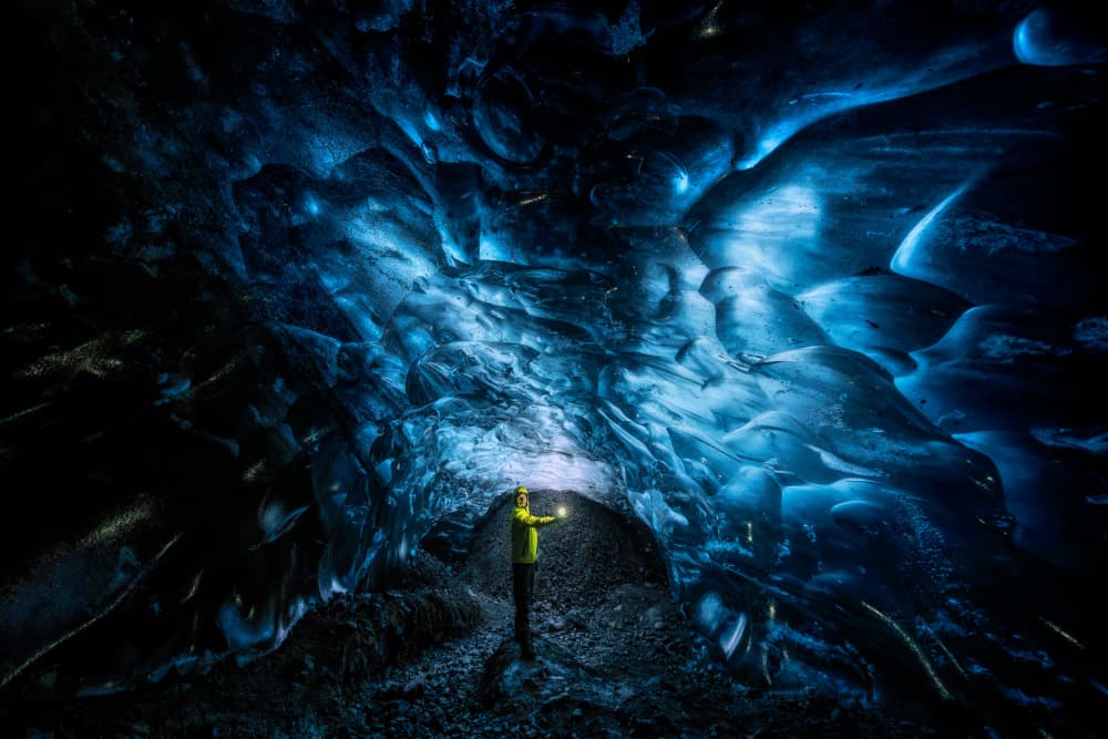 Blue Ice Cave Explorer by Ricardo Gayan — canvas wall art