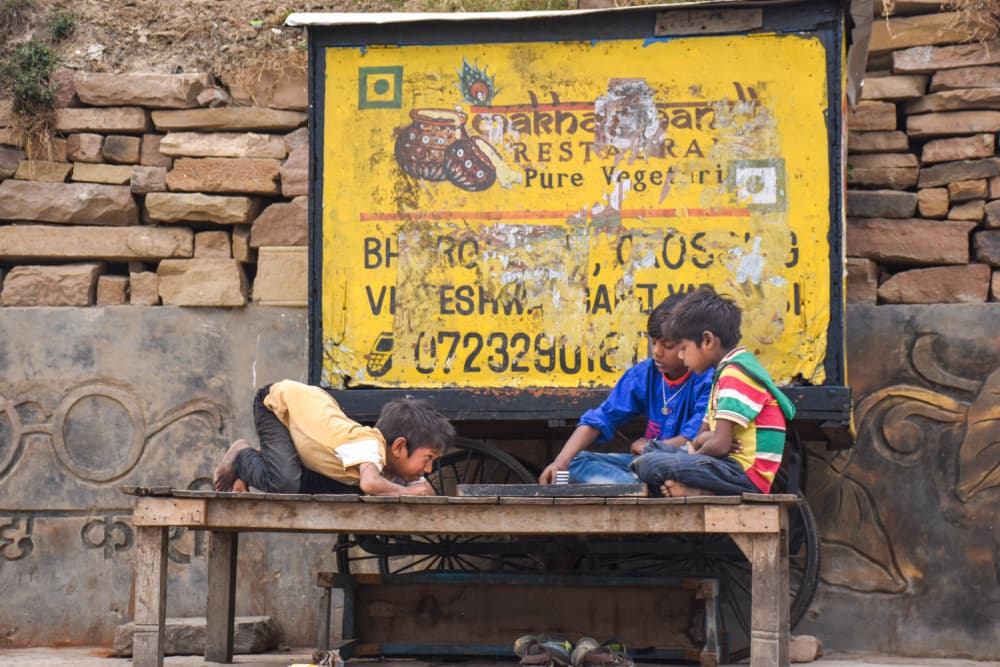 Boys Playing Street Game by Ilana Lam — canvas wall art