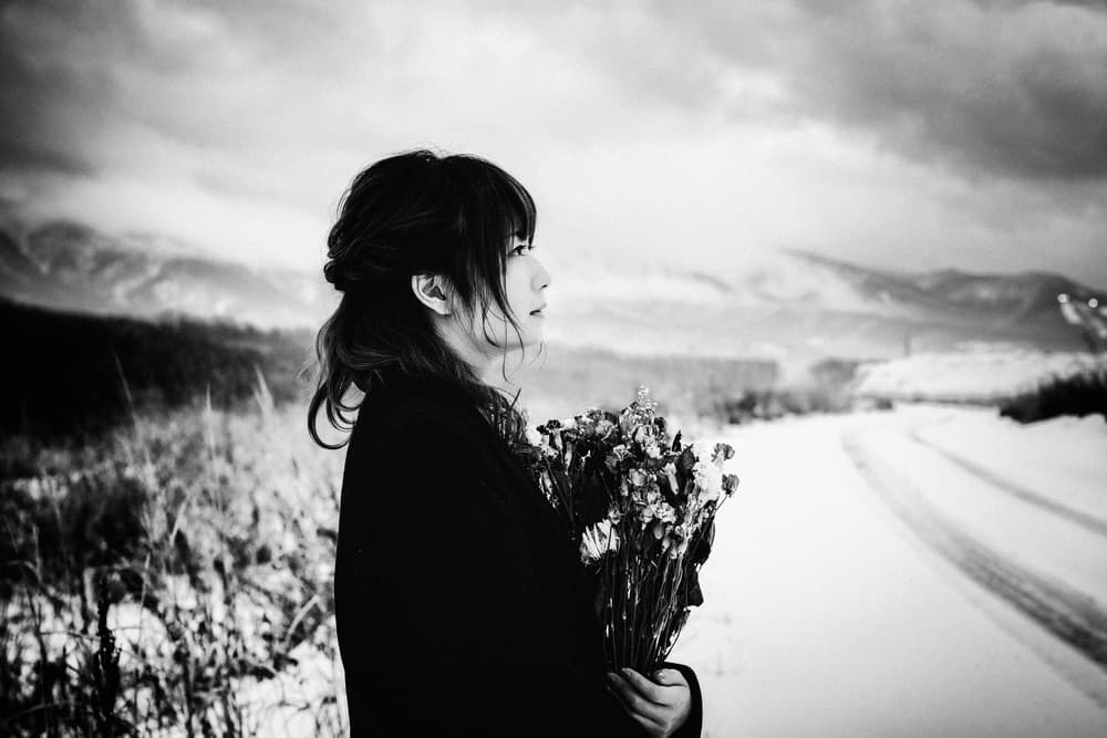 Pensive Woman Winter Flowers by Nobu Ishijima — canvas wall art