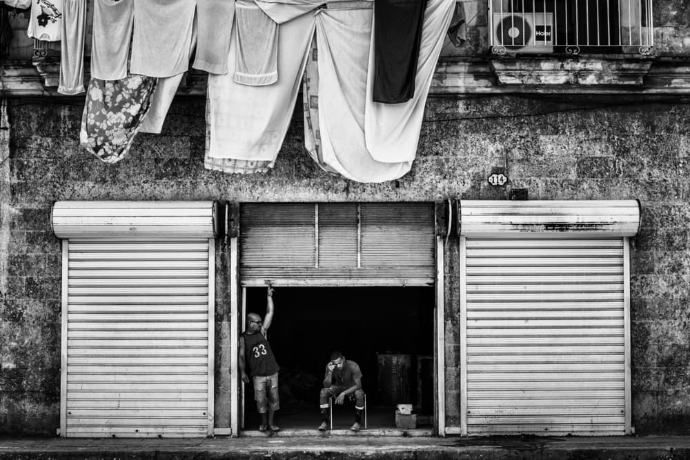 Two Men Storefront by Pavol Stranak — canvas wall art