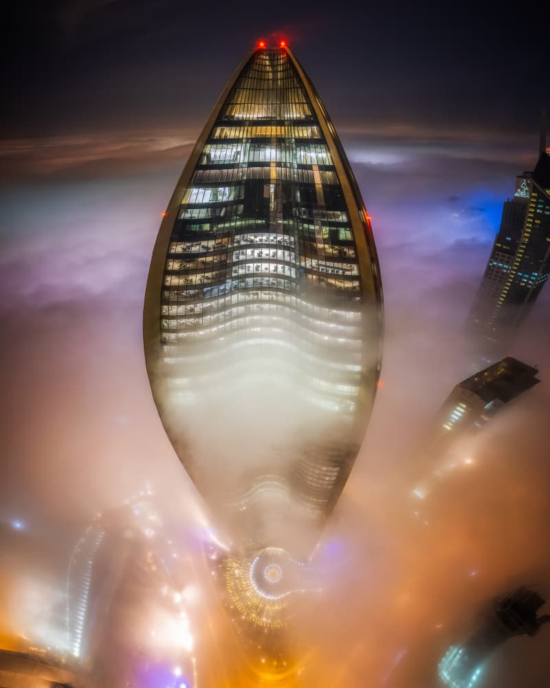 Skyscraper Night Fog by Faisal ALnomas — canvas wall art