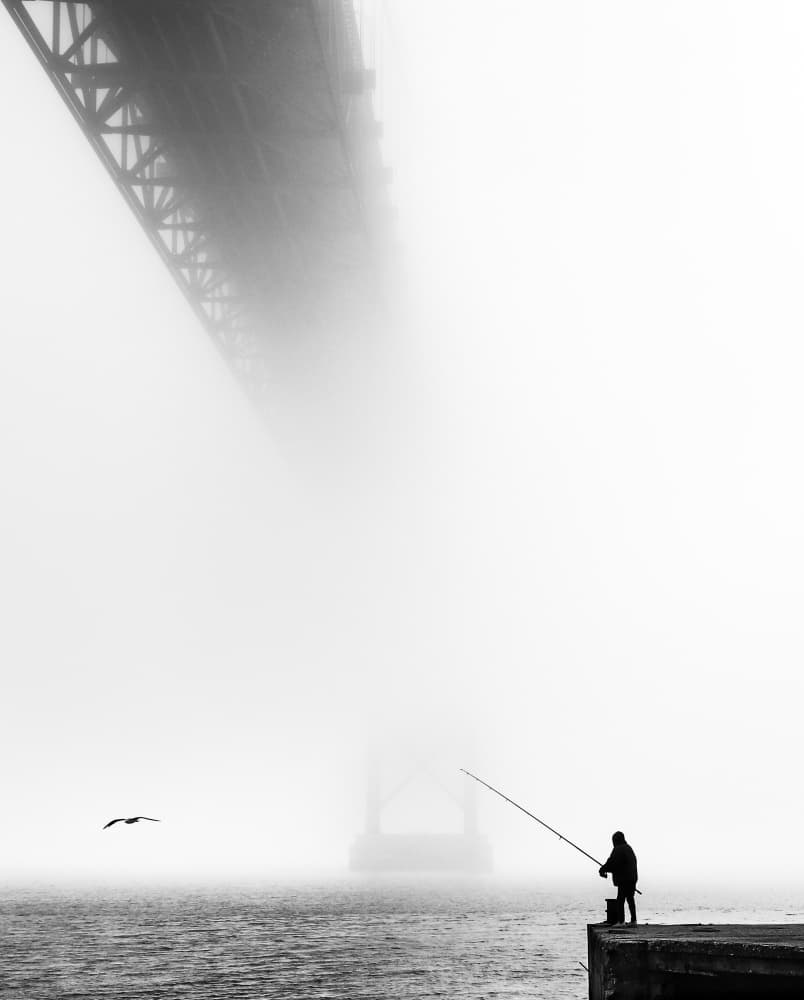 Fisherman Under Foggy Bridge by João Coelho — canvas wall art