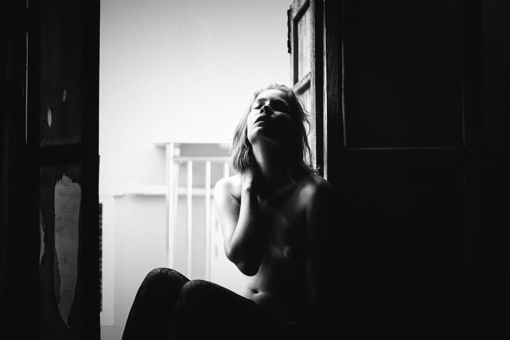 Pensive Woman In Light by Thanakorn Chai Telan — canvas wall art