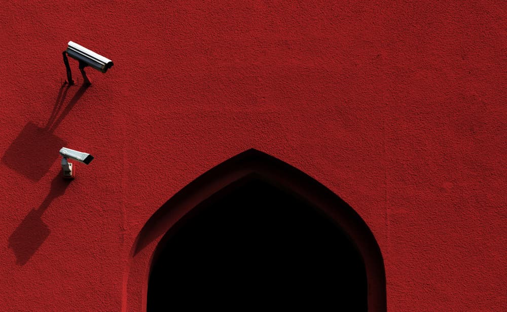 Red Wall Security Cameras by Muhammad Almasri — canvas wall art
