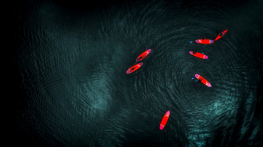 Dark Water Red Boats by Guy Krier — canvas wall art