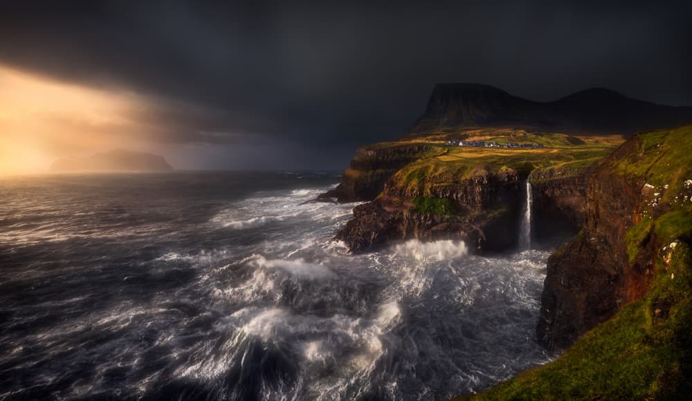 Stormy Coastal Village Waterfall by Krzysztof Browko — canvas wall art