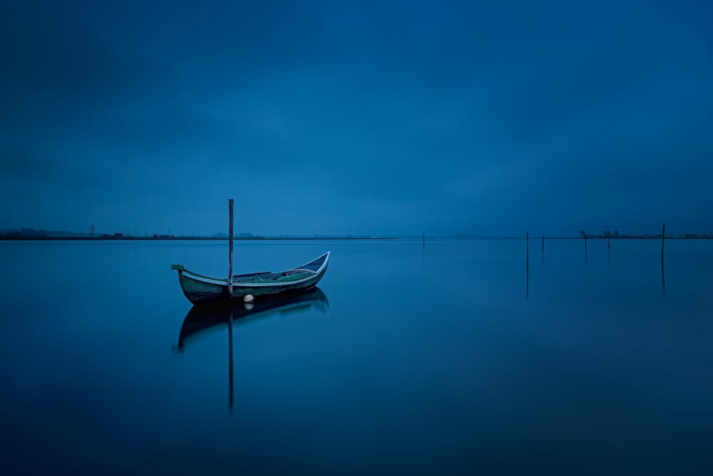 Solitary Blue Boat by Rui Ribeiro — canvas wall art