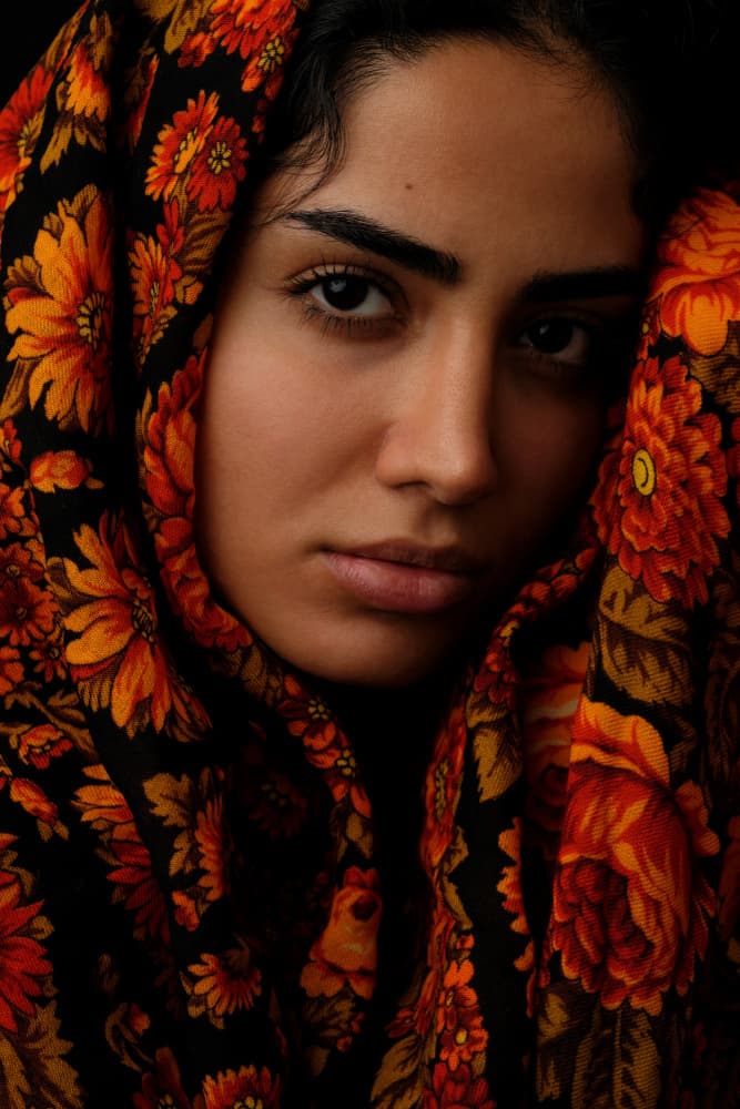 Woman in Floral Headscarf by Mehdi Mokhtari — canvas wall art