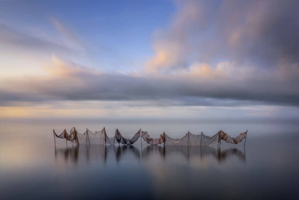 Serene Fishing Nets by Jorge Ruiz Dueso — canvas wall art
