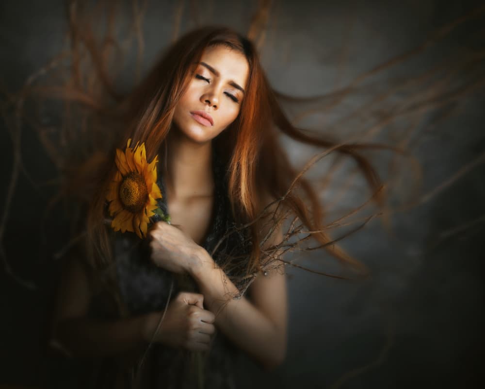 Serene Woman with Sunflower by Sebastian Kisworo — canvas wall art