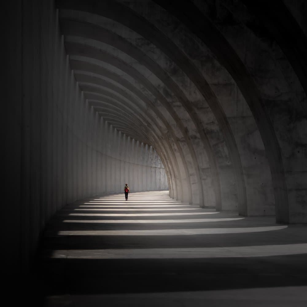 Lone Figure Arched Tunnel by Andy Dauer — canvas wall art