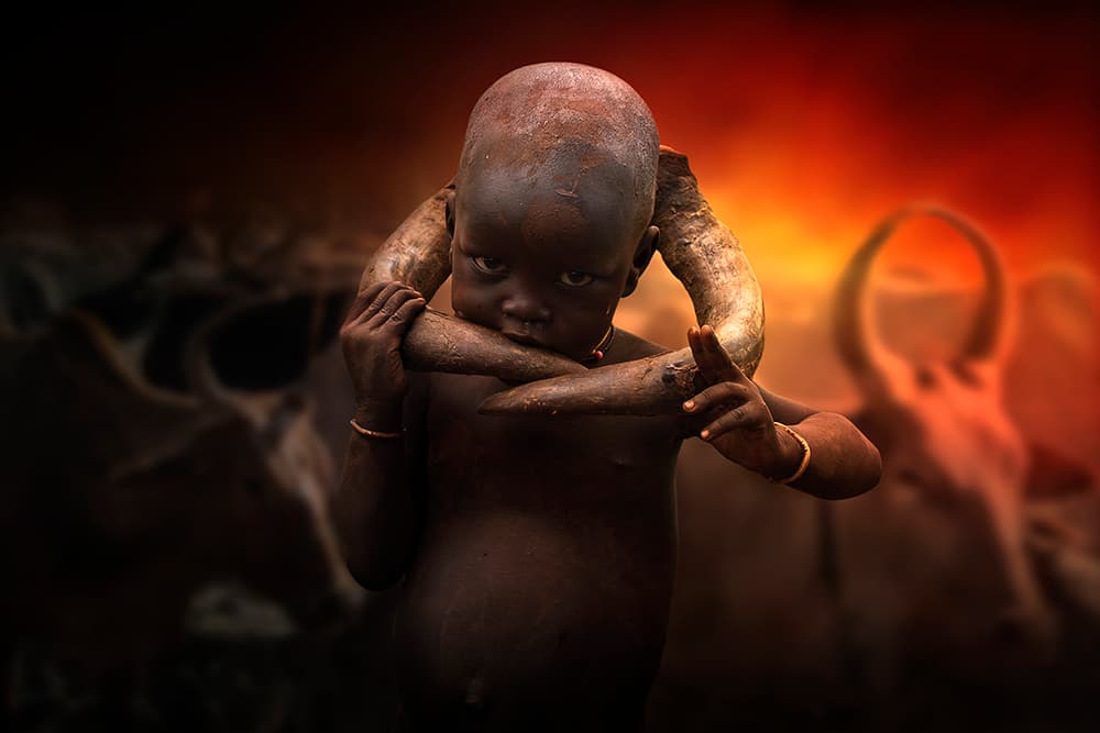 Tribal Child Holding Horns by Svetlin Yosifov — canvas wall art