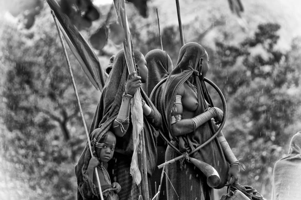 Tribal Women Rainy Walk by Trevor Cole — canvas wall art