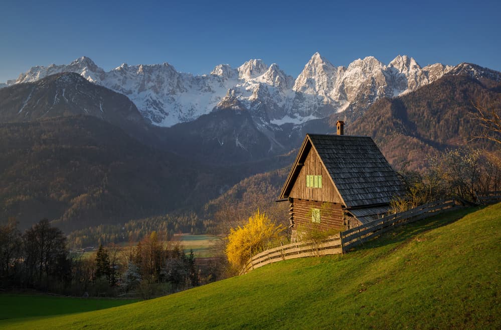 Rustic Cabin Snowy Mountains by Ales Krivec — canvas wall art