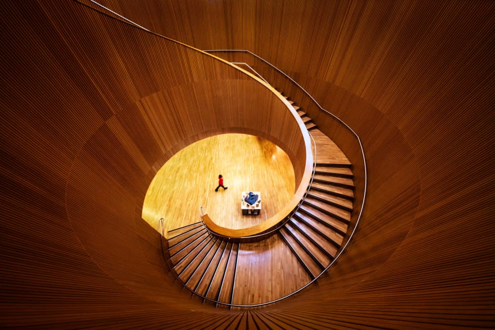 Warm Wooden Spiral Staircase by Steven Zhou — canvas wall art