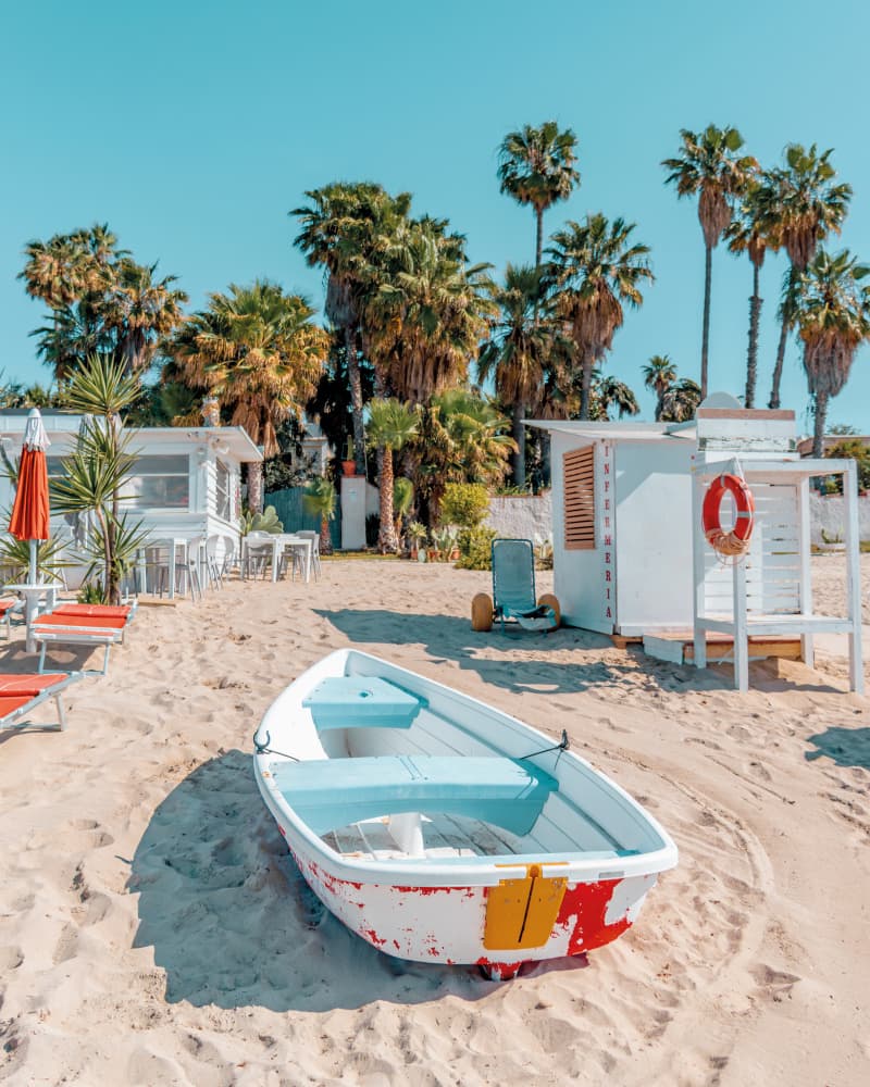 Beach Boat Under Palms by Gabor Estefan — canvas wall art
