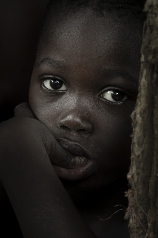 Pensive Young Child by Elena Molina — canvas wall art