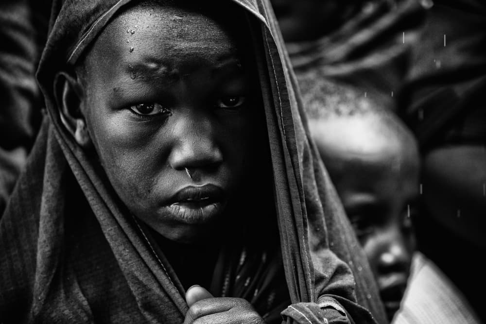 Solemn Child In Rain by Goran Jovic — canvas wall art
