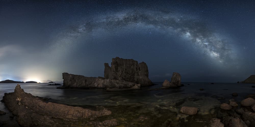Milky Way Over Coastal Rocks by Manuel Jose Guillen Abad — canvas wall art