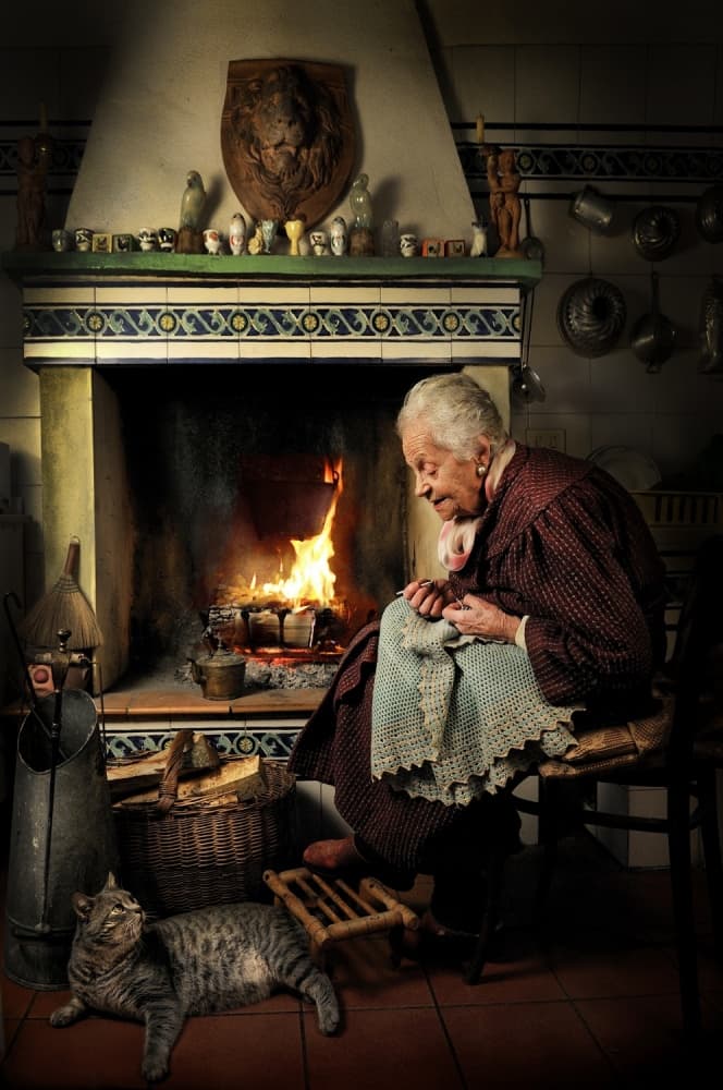 Cozy Fireside Knitting by Alberto Ghizzi Panizza — canvas wall art