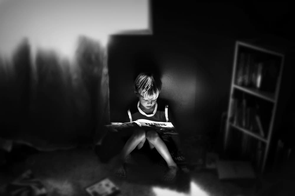 Focused Child Reading by Kapuschinsky — canvas wall art