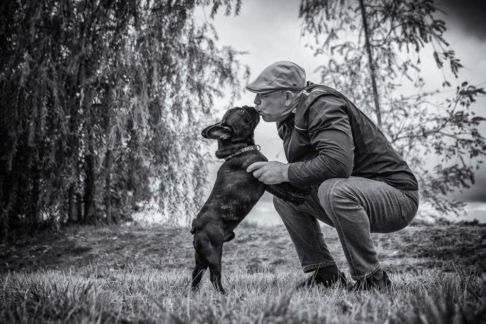 Man And Dog Kiss by Marcel Rebro — canvas wall art