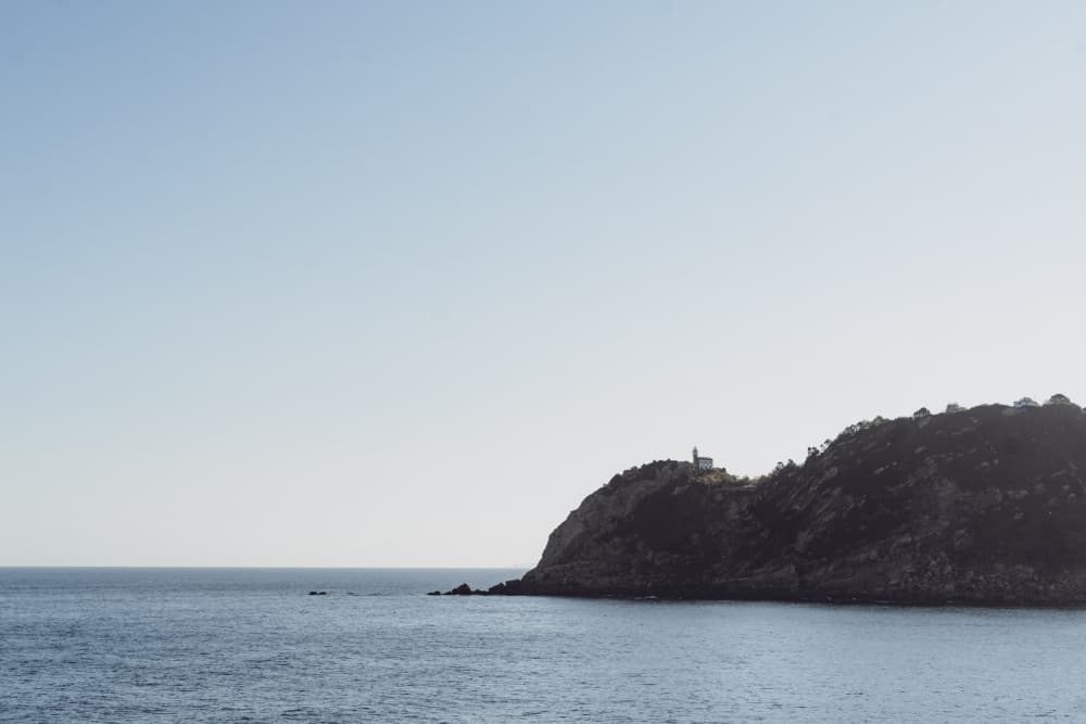 Coastal Island Lighthouse by Aimee Giles — canvas wall art