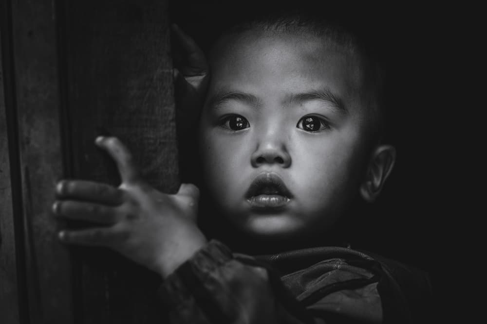 Curious Child's Gaze by Marco Tagliarino — canvas wall art