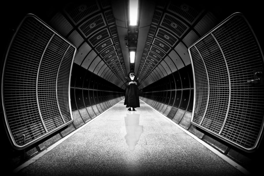 Nun in Dark Tunnel by Jorge Pimenta — canvas wall art