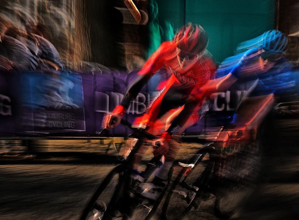 Speeding Cyclists by Lou Urlings — canvas wall art