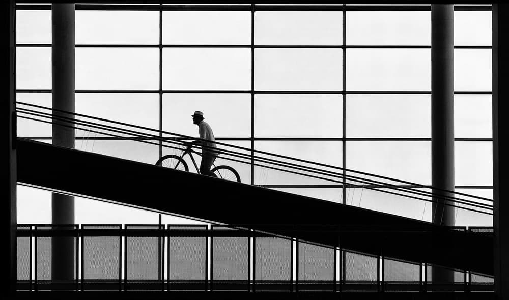 Urban Cyclist Silhouette by Samanta Krivec — canvas wall art