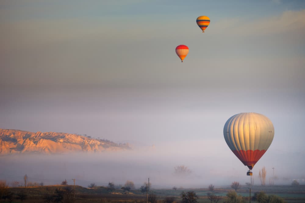 Cappadocia Sunrise Balloons by Merthan Kortan — canvas wall art