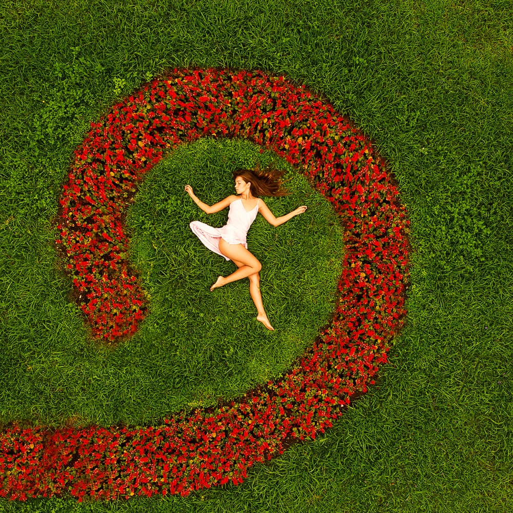 Woman In Floral Spiral by Mike Darzi — canvas wall art