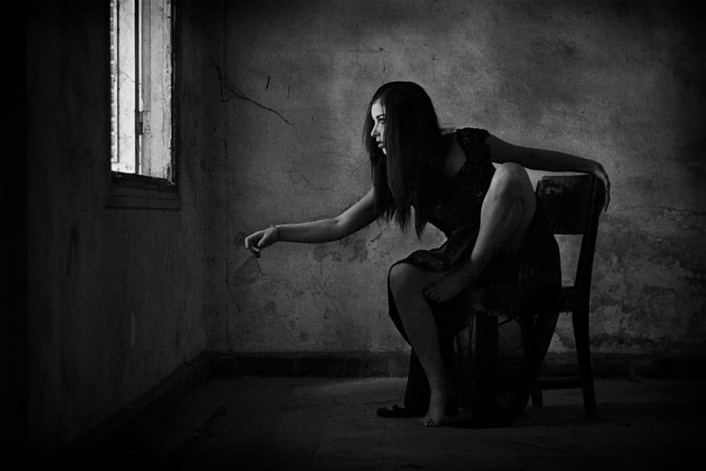 Pensive Woman Window Light by Joey Bangun — canvas wall art