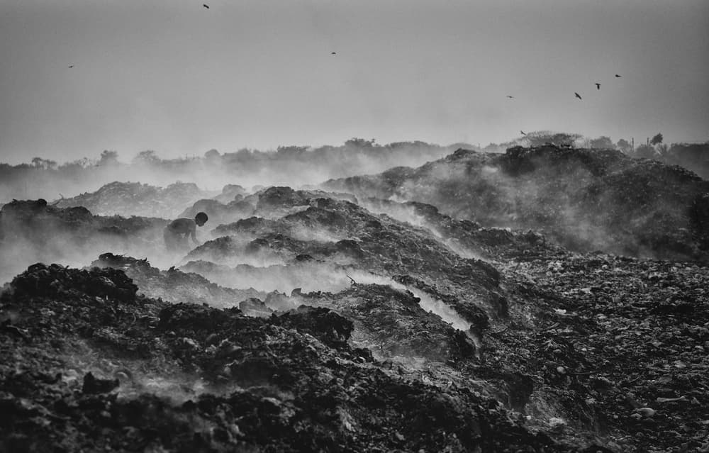 Smoky Landfill Worker by Avishek Das — canvas wall art