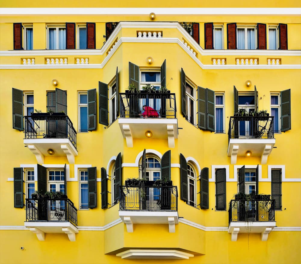 Vibrant Yellow City Building by Arnon Orbach — canvas wall art