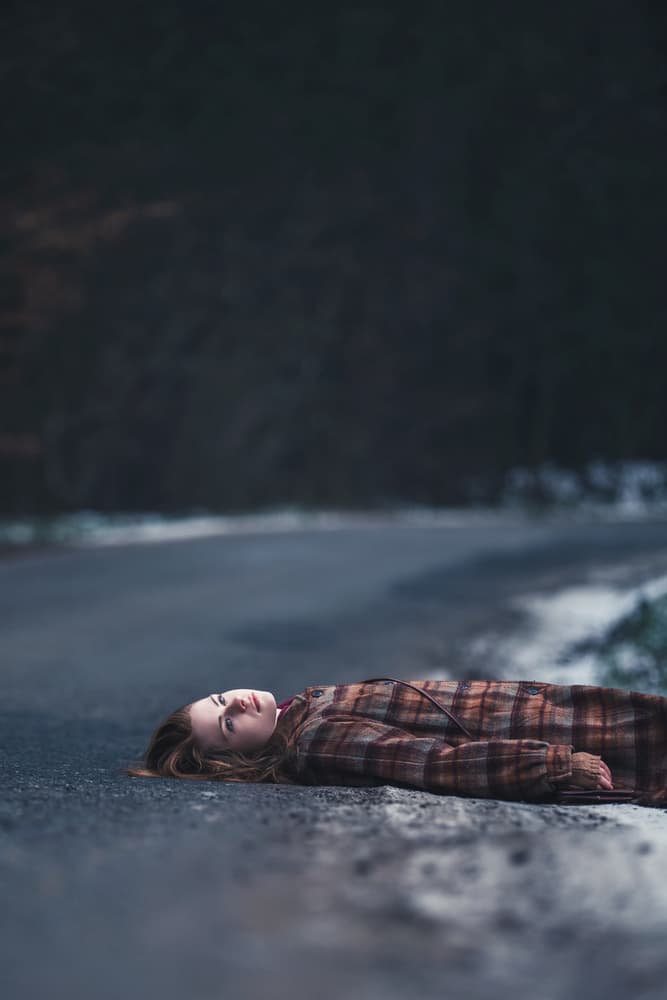 Pensive Woman Winter Road by Magdalena Russocka — canvas wall art