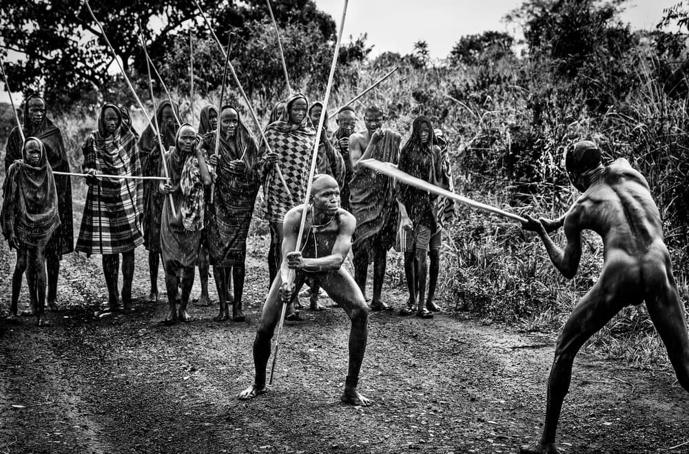 Tribal Stick Fighters by Joxe Inazio Kuesta Garmendia — canvas wall art
