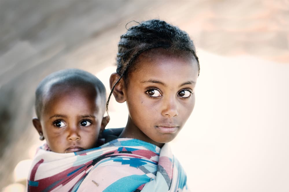 Young African Sisters by Trevor Cole — canvas wall art
